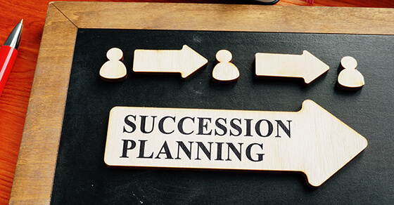 Game board with the words succession planning written on it