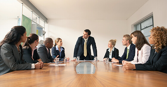 Professionals sitting around a table in a business meeting